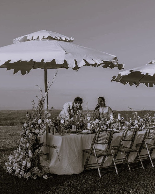 Harry and Loany creating a floral tablescape at the Dairy Ravensbourne 